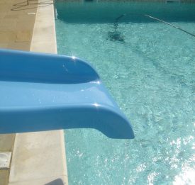 Add a fun feature such as slide to make the most of your pool | Blue Cube Pools