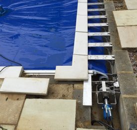 Safety cover pit assembly for disappearing leading edge | Blue Cube Pools