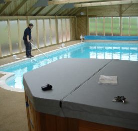 Outdoor now with enclosure and hot tub | Blue Cube Pools