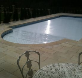 Outdoor pool with slatted cover | Blue Cube Pools