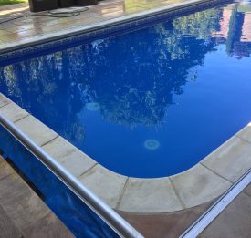 Grey oxford tile band and blue beach pebble. Pool liner refurbishment in Hertfordshire | Blue Cube Pools